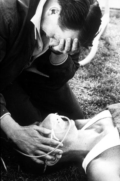 Ron Clarke is given oxygen by Australia's weeping team doctor Brian Corrigan after collapsing after the 10,000m final at the 1968 Olympics in the thin air of Mexico City ©Popperfoto/Getty Images