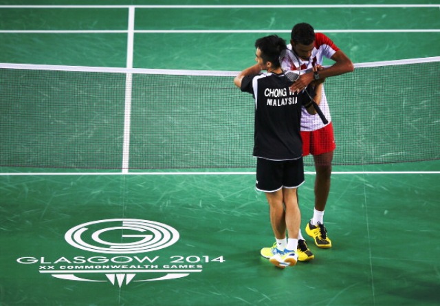 Chong Wei Feng and Rajiv Ouseph embrace after they played in the best match of the day during the mixed team gold medal decider at Glasgow 2014 ©Getty Images 