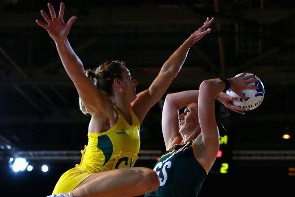 Lauren Geitz of Australia attempting to block the shot of South African Anna Bootha in a netball match the Aussies won 64-40 ©Getty Images