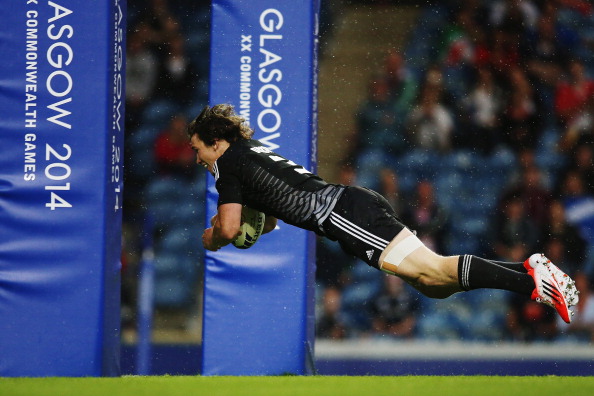 Sam Dickson of New Zealand dives over to score a try against Barbados on the first day of the rugby sevens competition ©Getty Images
