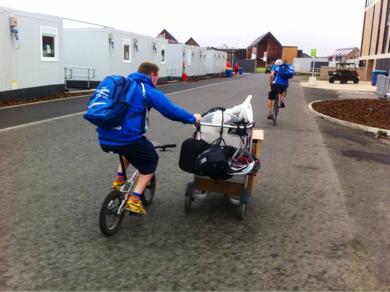 Four wheels bad, two wheels good. Scottish cyclists transporting equipment around the Athletes' Village ©Facebook