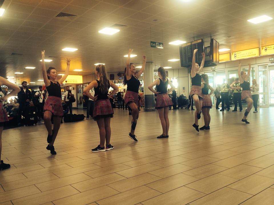 Scottish dancers greet Team England as they arrive at Glasgow Airport for the Commonwealth Games ©Facebook