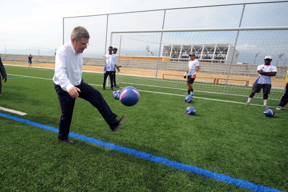 Thomas Bach illustrates football skills befitting of a German during the unveiling today ©AFP/Getty Images