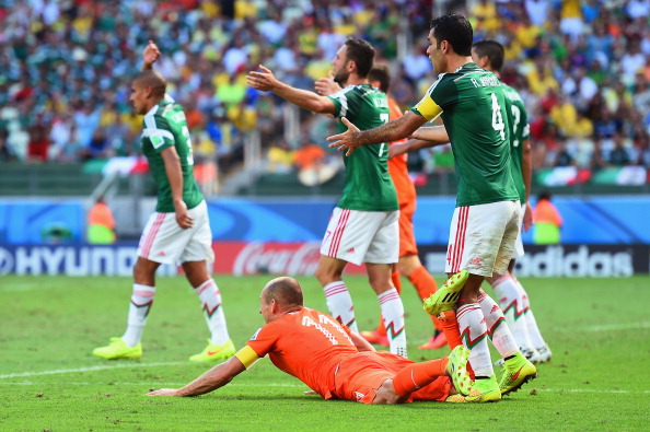 Arjen Robben goes to ground to win the crucial penalty for The Netherlands in their World Cup match against Mexico ©Getty Images