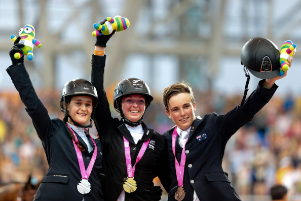 Emily Fraser of New Zealand (centre) won gold in the equestrian individual jumping final ©Getty Images