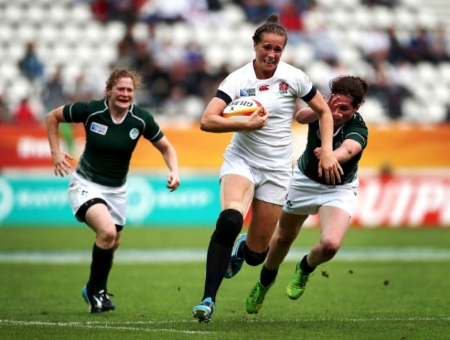 Emily Scarratt bursts through the Irish defence during her side's emphatic win over their neighbours in Paris ©Getty Images