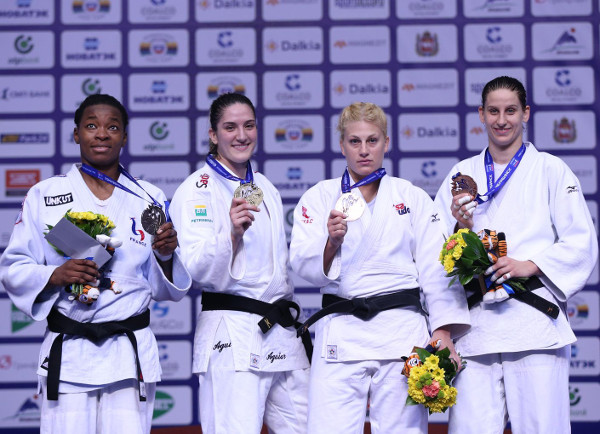 Mayra Aguiar (second left) won her first World Championships gold medal and now has her sights set on Rio 2016 ©IJF