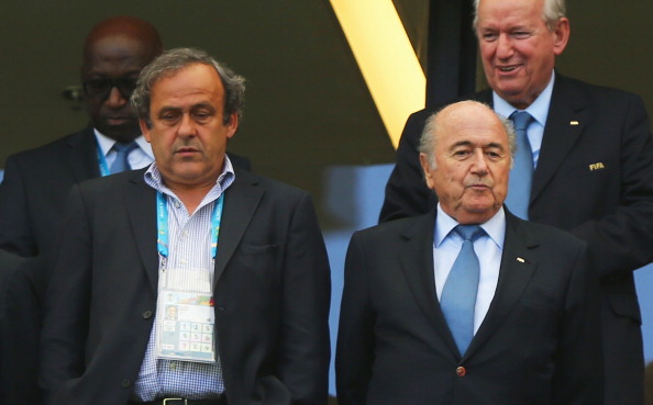 Michel Platini (left) has been highly critical of Sepp Blatter (right), but has chosen not to run against his for the FIFA Presidency ©Getty Images