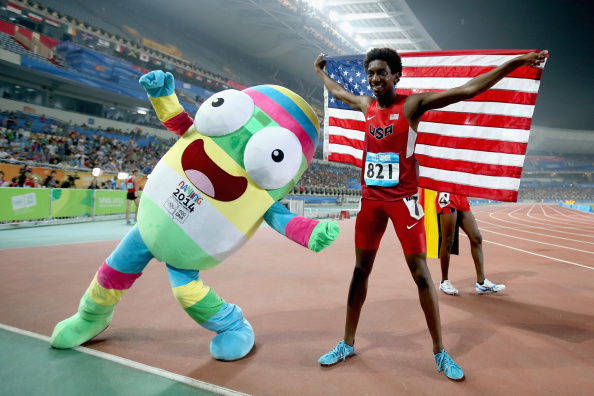 Myles Marshall of the United States celebrated winning the men's 800m final with a little help from Nanjing 2014's mascot ©Getty Images