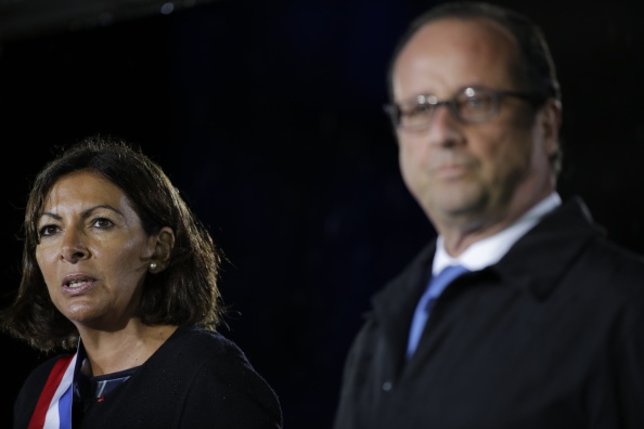 Paris Mayor Anne Hidalgo, pictured with President François Hollande, has indicated a 2024 Olympic and Paralympic bid by the French capital may not be viable under the current financial climate ©AFP/Getty Images