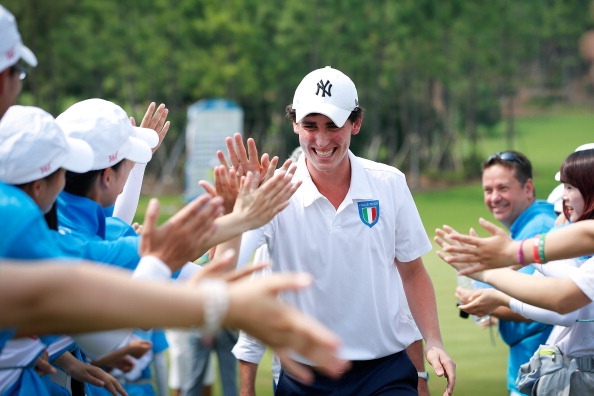 Renato Paratore of Italy high-fived volunteers after sharing gold in the first Olympic golf competition in 110 years ©Getty Images