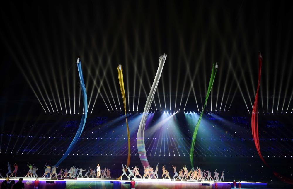 Ribbons in the Olympic colours had a figure suspended at the top of each one ©Nanjing 2014