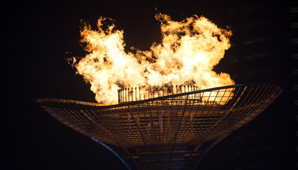 The Olympic Flame burning bright over the Nanjing Olympic Sports Centre ©AFP/Getty Images