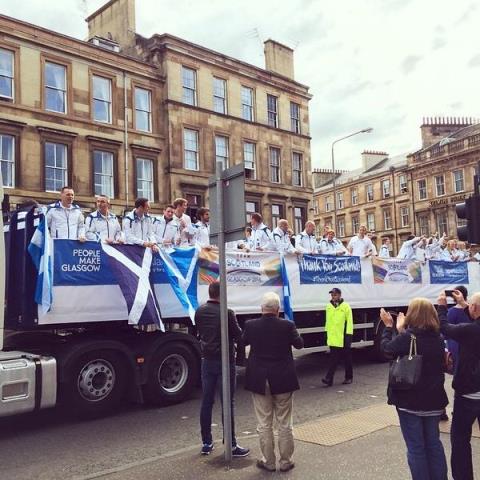 The Scottish team make their way through the streets of Glasgow during the Athletes' Parade ©Twitter