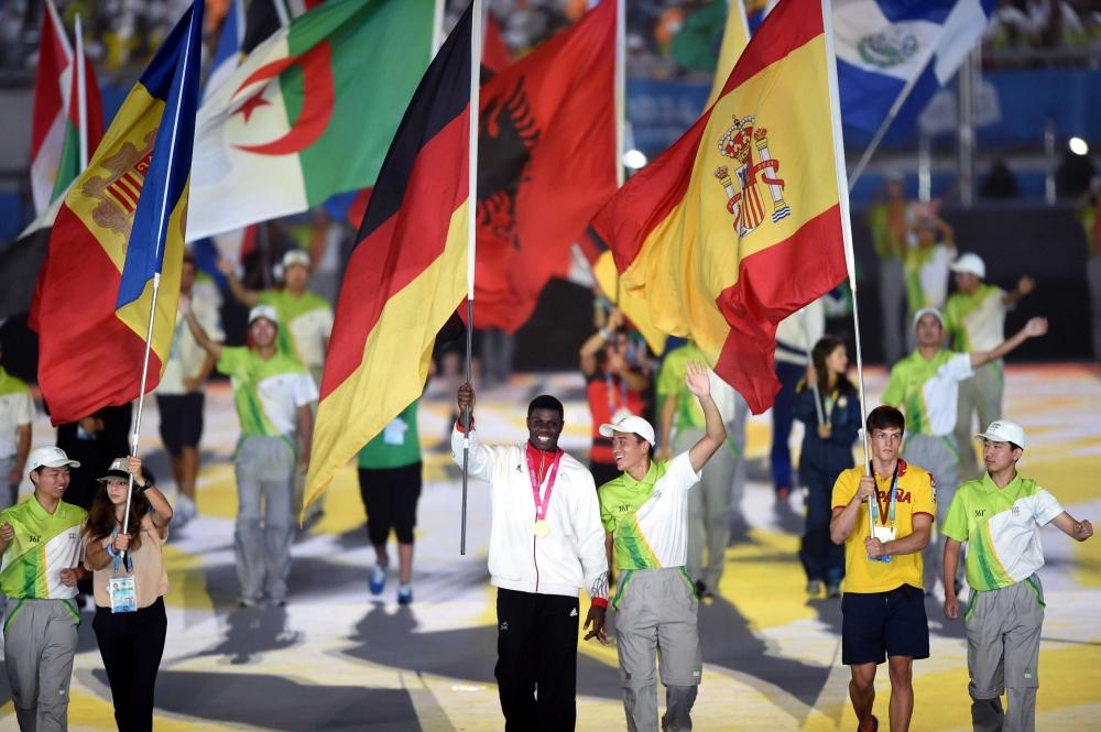 The flags of all the competing nations were brought into the stadium ©Nanjing 2014