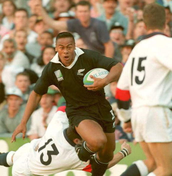 All Black Jonah Lomu has shrugged off Tony Underwood and is evading Will Carling's tap tackle, which means that England full back Mike Catt is about to get run over as the New Zealander scores the first of four tries in his side's semi-final win at the 1995 Rugby World Cup ©Getty Images