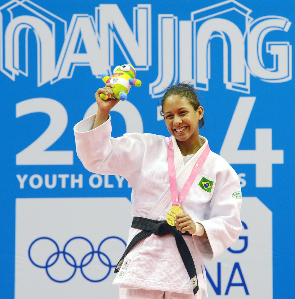 Brazilian Layana Colman clutched the Nanjing 2014 mascot after winning the women's under 52kg judo ©Nanjing 2014