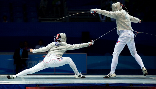 Ivan Ilin of Russia battles to fencing glory earlier ©Getty Images