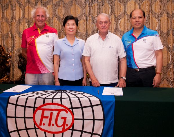 Zhang Libang and Bruno Grandi were joined by Chinese Gymnastics Association President Luo Chaoyi and FIG secretary general Andre Gueisbuhler ©FIG