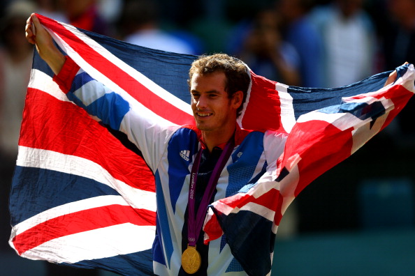 Andy Murray holds aloft a Great Britain flag after winning the mens singles gold medal at London 2012 ©Getty Images