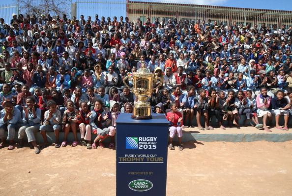 Children gathered round the Webb Ellis Cup during a visit to the Father Pedro Foundation in Madagascar, as it embarked on its world tour in June ©Getty Images for England Rugby 2015