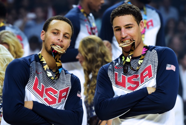 Guard Stephen Curry (left) and forward Rudy Gay gave their gold medals the taste test ©AFP/Getty Images