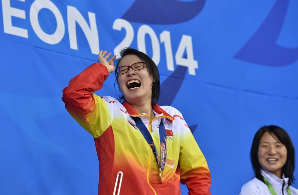 A delighted Fu Yuanhu celebrates 50m backstroke gold AFP/Getty Images