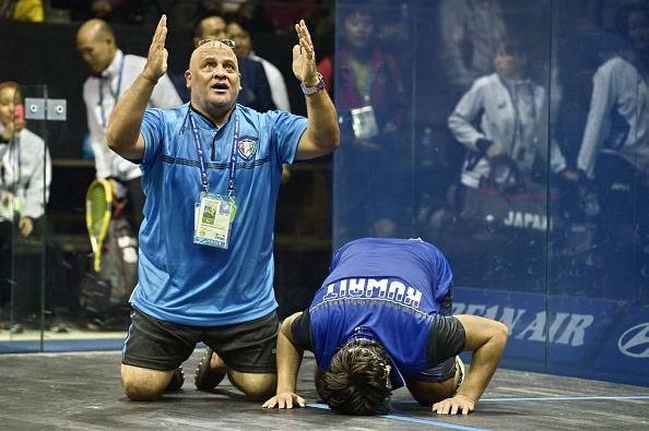 Abdullah Almezayen celebrates his remarkable squash singles title ©AFP/Getty Images
