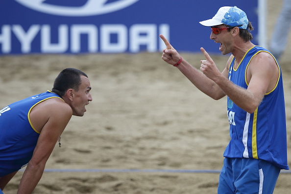 Alexandr Dyachenko and Alexey Sidorenko of Kazakhstan celebrate en route to beach volleyball gold ©Getty Images