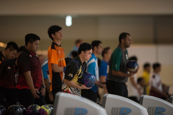 Athletes competing in the mens bowling competition ©AFP/Getty Images