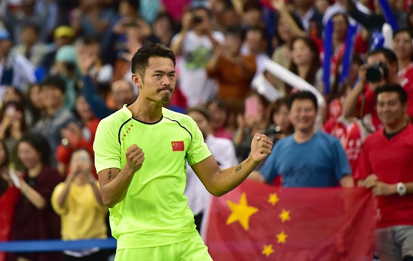 China's Lin Dan celebrates after defeating compatriot Chen Long in the men's singles badminton final ©Getty Images