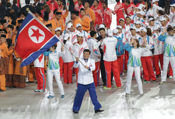 Flag bearer Sok Yong-Bom of North Korea arrives during the Opening Ceremony, to impressive applause ©Getty Images