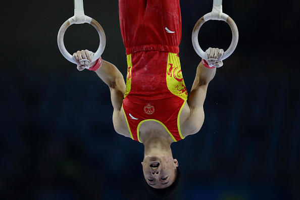 Huang Xi of China competing in the rings in the team gymnastics competition ©Getty Images