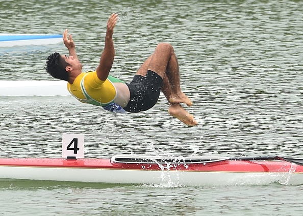 Iran's Saeid Fazloula performed a somersault after coming second along with team mate Ali Aghamirzaeijenaghrad in the men's K2 1000m final ©AFP/Getty Images