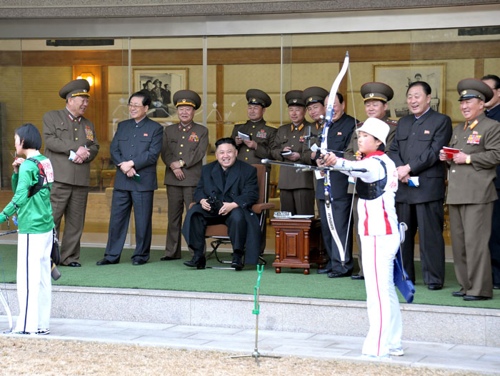 North Korean leader Kim Jong-un watches his country's archers train for the 2014 Asian Games ©AFP/Getty Images