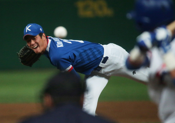 Kim Kwang-hyun pitching South Korean to the gold medal late in the baseball competition ©Getty Images