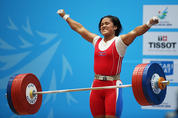 North Korea's Kim Un-ju celebrates winning her country's fourth gold medal in the weightlifting ©AFP/Getty Images