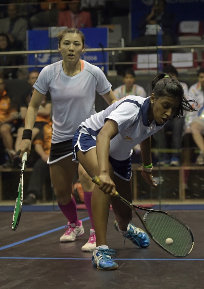 Arnold Delia Odette outplaying her Indian opponent en route to Malaysian team gold ©AFP/Getty Images