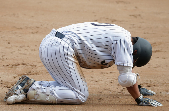 Masataka Iryo of Japan reacts after the sides shock loss to Taiwan in the baseball ©Getty Images
