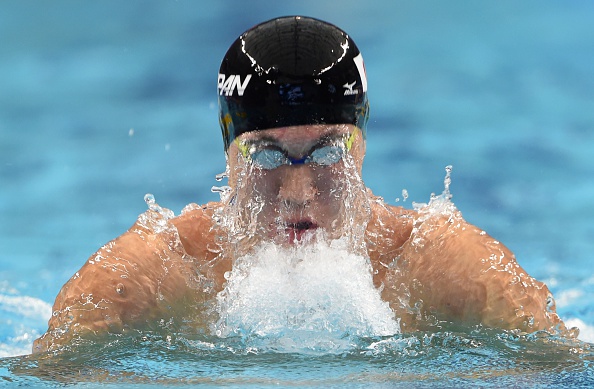 Naoya Tomita swimming over 100m breaststroke at the Asian Games ©AFP/Getty Images