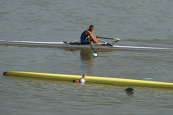 Singh Sawarn of India takes a tumble following his single sculls bronze medal earlier ©Getty Images
