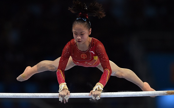 Tan Jiaxin helped China to victory in the women's artistic gymnastics team event for the 11th consecutive Asian Games ©AFP/Getty Images