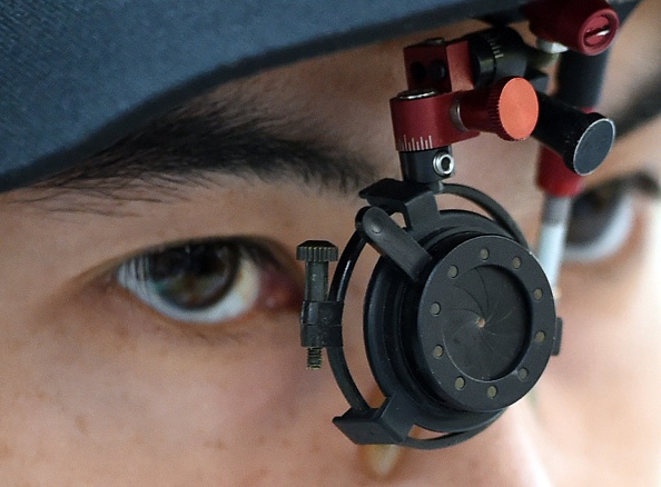 Thailand's Pongpol Kulchairattanas eye-gear is seen during the men's 25m centre pistol event ©AFP/Getty Images