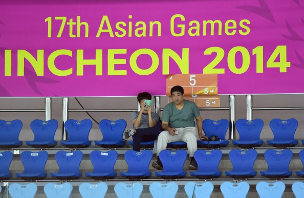 Three rows of, almost, empty seats at the badminton at Incheon 2014 ©AFP/Getty Images