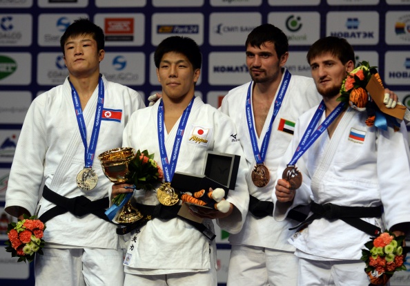 Victor Scvortov (second right) on the podium after winning bronze for UAE at the World Championships in Chelyabinsk ©AFP/Getty Images