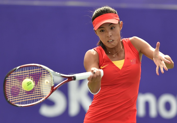 Wang Qiang of China wins the opening set against Kumkhum Luksika of Thailand in their women's singles tennis final ©AFP/Getty Images