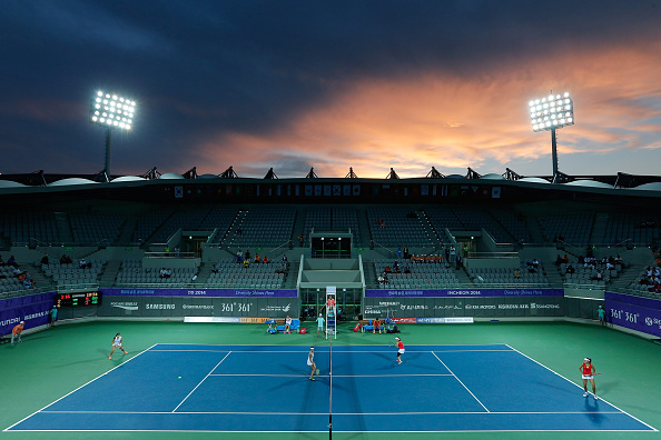 Weather and tennis neatly juxtaposed during the women's team final ©Getty Images