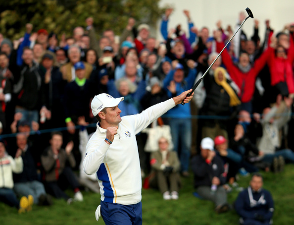 Justin Rose celebrates after holing a putt on the 18th green to secure a half-point for Europe in the afternoon foursomes ©Getty Images 