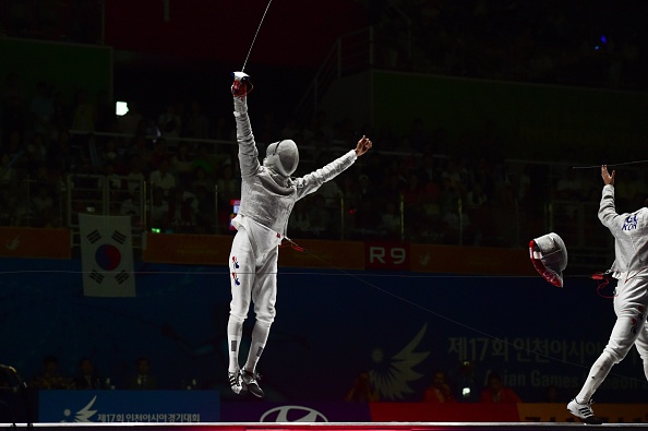 Kim Jung-Hwan of South Korea jumped for joy after beating countryman Gu Bon-Gil in the men's sabre fencing individual final ©Getty Images