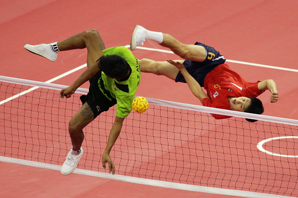 Kim Young-Man of South Korea and Aung Zaw Zaw of Myanmar challenged for the ball in the sepak takraw men's double final, which was won by Myanmar ©Getty Images